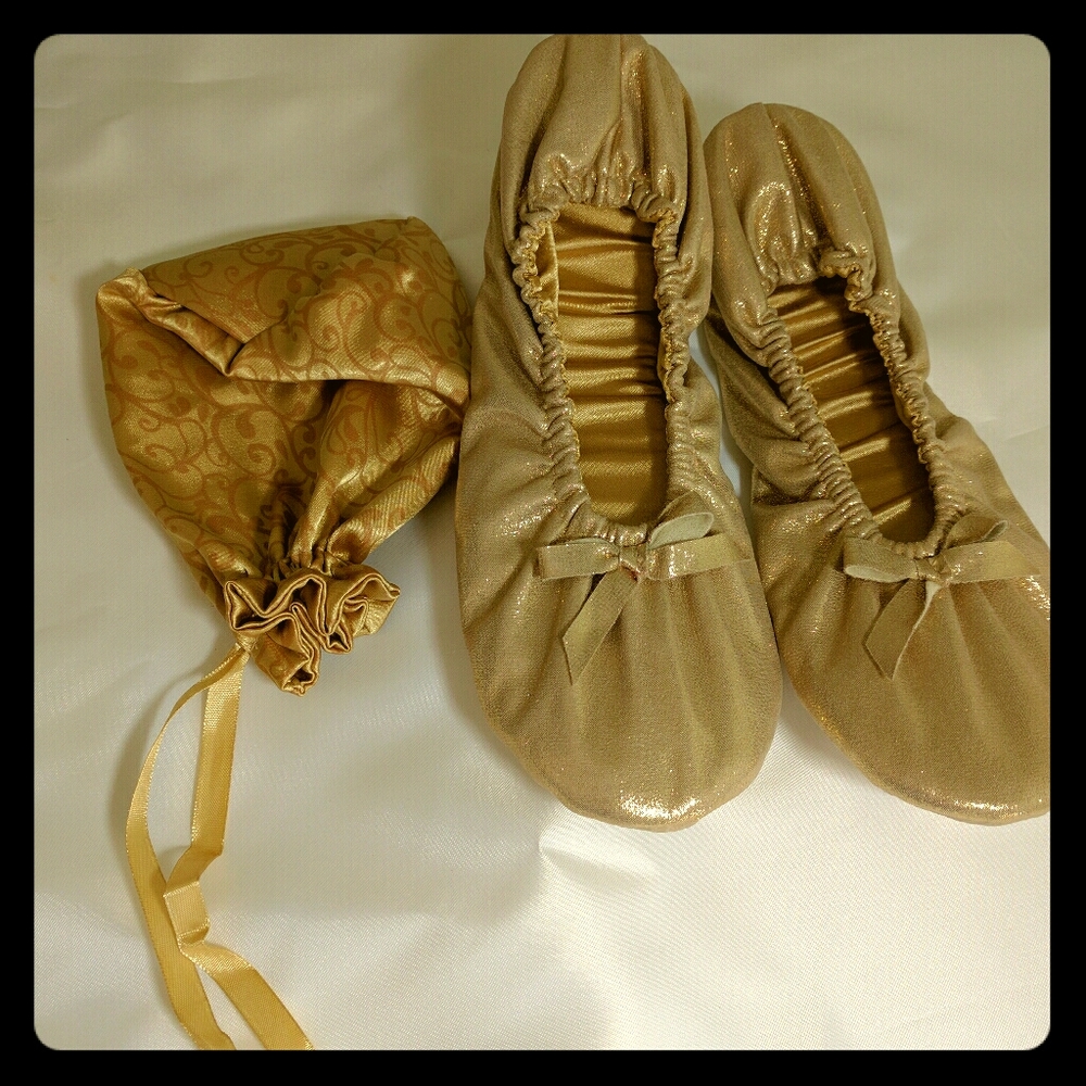 Gold squishy ballerina flats with carry case.